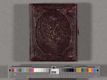 [Mary Emma Hoyt?] in profile, wearing a plaid dress