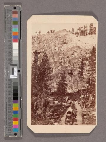 Palisade Rocks with Road and Teams descending Western Summit