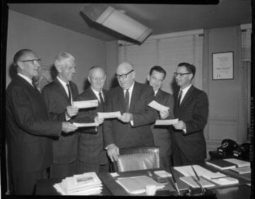 Presenting checks to County Tax Collector, Byram