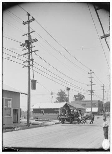 Raising transformer onto pole with electric truck