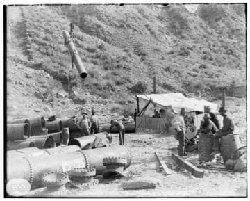 A construction crew standing by Hoist #7 at Mill Creek #3 Hydro Plant