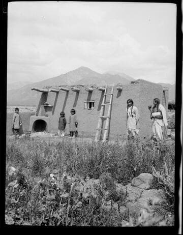John Concha with his family and his cousin, at ranch house, Taos