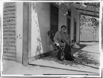 Woman and child outside residence