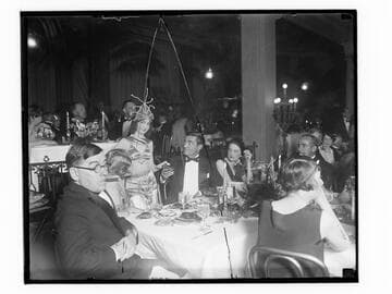 People sitting at a table at the Club Casa del Mar, Santa Monica, California