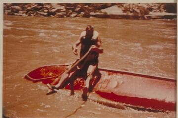 Rod Sanderson riding the bottom of the "Rattlesnake" after capsize in Vulcan Rapid
