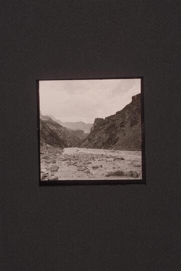 Boat pulling in at lower end of Hermit Rapid.  Jack Couffer is making motion pictures at left as Ed Ralph stumbles along the shore, right center