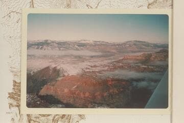 Across Toroweap Valley.  Mt. Emma upper left; Mt. Logan upper center; Mt. Trumbull upper right; Vulcans Throne lower left