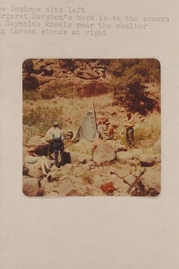 Sunshade for lunch at Hells Half Mile, right bank.  Joe Desloge sits left; Margaret Marston's back is to the camera; A. K. Reynolds kneels near the shelter; Lug Larsen stands at right