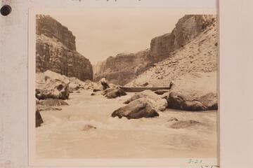 The Dusty Dozen lining and portaging Badger Creek Rapid