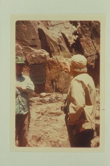 Dock Marston ties the history with the two plaques at the mouth of Separation Canyon during the History Workshop cruise of Grand Canyon Expeditions, Inc