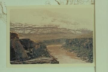 Down from Mile 216.7 showing snow on the cliffs.  217 Mile Canyon can be seen above point where the river disappears