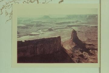 Southwest down Stillwater Canyon from Candlestick Tower.  The Turks Head is left of center.  Deadhorse Canyon is right of center.  Back of the un-named butte at upper left is Elaterite Butte