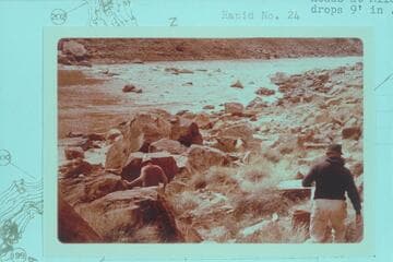 Bill Belknap and Dock move down to camp at Mile 202.25.  The rapid is No. 23 which heads at Mile 202.20 and drops 9 ft. in .15 miles