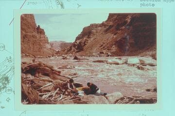 Up River in Rapid No. 23.  Buzz Belknap and Dock Marston work with the Sportyaks.  The Sliced Boulder is center