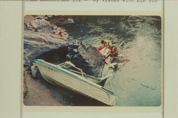 Salvage of July 16,1966 at head of Gneiss Canyon Rapid.  The hull is foreground the transom with engine beyond
