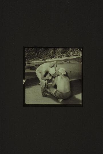 Rod Sanderson and Bill belknap fit a patch on the CACTUS below Tuna Creek Rapid