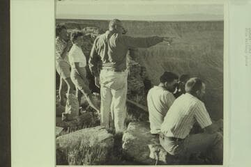 L. Miller and Gene Segerblom get a report on the river party from chopper pilot Lynn Roberts.  Buck Farm Point