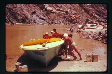 Rolling the "Wee Yellow" for repairs above Tuna Rapids
