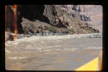 "Wee Red" climbs Vulcan Rapids