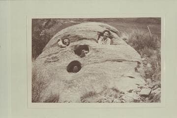 Pumpkin Rock.  Harry Aleson and Dr. F. M. Smith in the rock