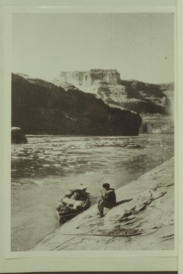 John Wetherill and the outboard boat in Glen Canyon of the Colorado River