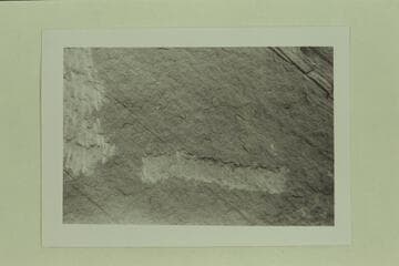 Cutting away of a date on the boulder at the foot of Rainbow Bridge