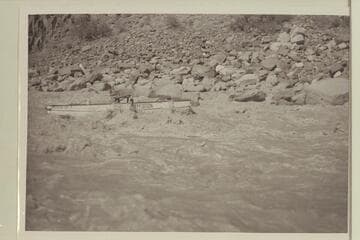 Hugh Cutler putting the "Mexican Hat II" through Dubendorff Rapid.  The oar action by Cutler appears to be a braking