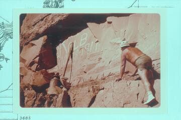 Bill Belknap climbs to the Kolb inscription at Mile 202.25, right bank.  The inscription was painted by Emery Kolb 1911, Oct. 28