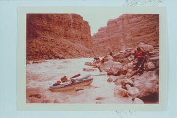 Dock Marston lining a Yak in Dark Canyon Rapid.  Jorgen Visbak and Buzz Belknap in distance