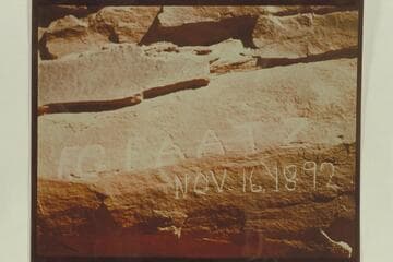 Name of F. G. Faatz cut on wall of Glen Canyon 6 miles above Lees Ferry.  The same name with the date August 27 1892 is cut on the right bank of Cataract Canyon.  Photo sent by Art Green, 1956, Oct. 09