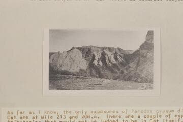 Near view of gypsum plug shown in Plate 4A looking downstream in tributary canyon.  The contact of the gypsum cuts across Hermosa strata at the right.  Side canyon is at Mile 206.85 in Cataract Canyon