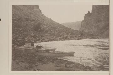 Boats of the Pathe-Bray party at left bank at Mile 204.1.  Probably the site of the camp of 1927, Nov. 20-22.  Photo was captioned:  "below Rapid No. 8."