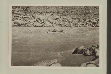 One of the large four-oared boats of the Eddy fleet running a rapid in upper Cataract Canyon.  Copied from Carey collection