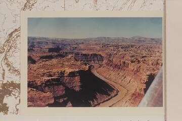 Down Cataract Canyon from the mouth of the Green River.  The Henry Mts. are on the skyline.  The Land of Standing Rocks is right and Spanish Bottom is center