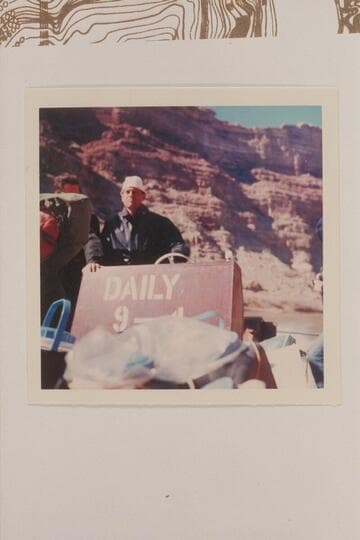 Tex McClatchy driving his jet boat "Major Powell" at the dam site, Mile 216, Cataract Canyon