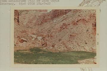 Fill back of rock slide in side canyon, Mile 184.1, which was formerly a pond