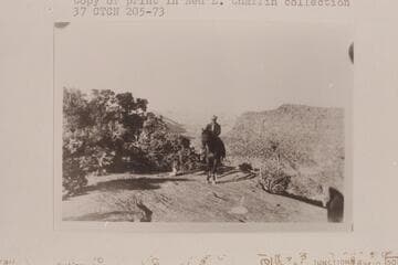Bill Racy on Teddy.  Flint Flat.  The Maze over Bill's shoulder