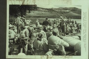 University of Colorado Alumni embarking in Bus Hatch's baloneys for a transit of the Yampa River Canyon [on photo reverse:  at Deerlodge Park]