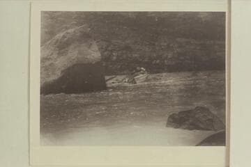 Emery Kolb hits the stern of the "Edith" on the large rock in Ashley Falls.  Low water