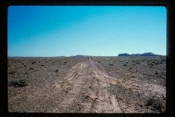 Dot and Harry on road away from top of Halls Creek