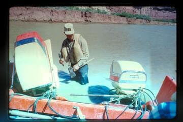 Carroll Lambeth hammers out a prop, Mile 25; Stillwater Canyon