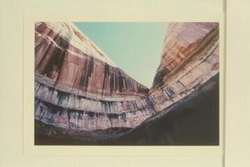 Cave at head of Moepitz Canyon.  The camera is pointed almost straight up from the spring at the bottom of the cave.  This cave appears in Marston photo 5810 GNCN 73.3.  The bottom of the cave is shown in Marston photo 6010 GNCN 73.18.21