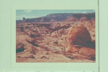 Down canyon at Mile 74.  Across Glen Canyon to Lion Rock at left; Fifty Mile Mountain at upper center and Sixty Mile Point at upper right