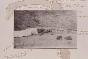 The Fort at Lees Ferry surrounded by tents making the first camp of the Spencer placer crew on the right bank at Lees Ferry