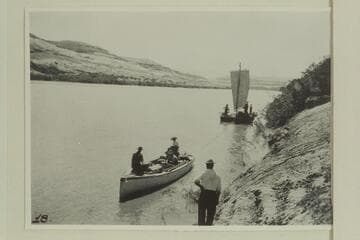 Launch of the Hoskanini Mining Company hauling the construction scow up to dredge site in Glen Canyon