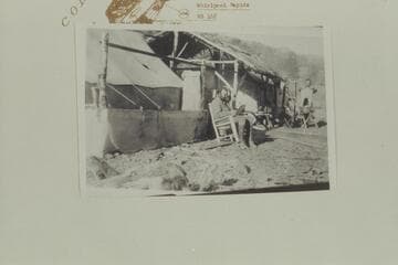 Camp for Placer operations on Gretchen Bar.  Johnson is center, Andy is watching