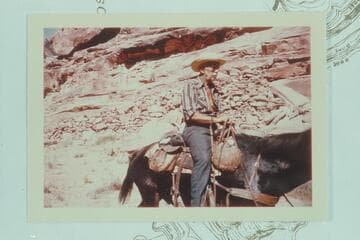 Archeyes Masland riding on the flat at the foot of the Dugway at left bank at Hole in the Rock