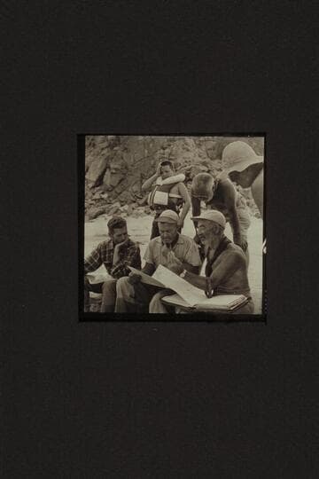 Briefing at Diamond Creek.  Hugh Cutler sits lower left.  Rod Sanderson and Marston work on the details from the charts.  Buzzy Belknap indicates that all the talky-talk gives him a pain.  Masland appears to find it interesting