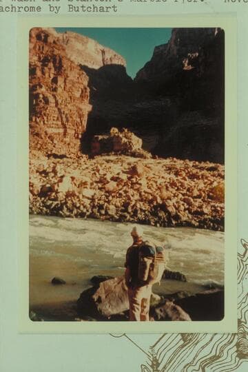 Jorgen Visbak looking across 24.5 Mile Rapid into the mouth of Tanner Wash and Stanton's Marble Pier
