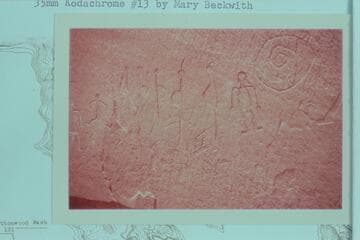 Petroglyphs beside ruins on talus just at water edge